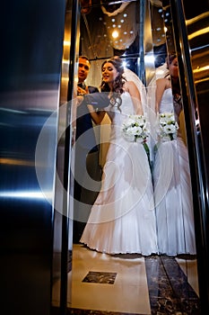 Bride and groom in lift