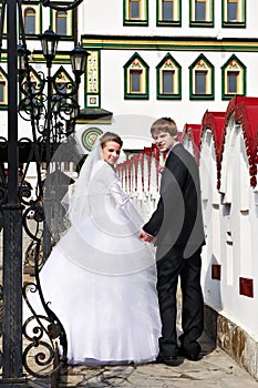 Bride and groom about the luxurious palace