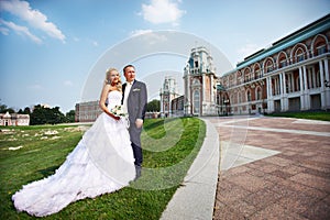 Bride and groom about luxury palace