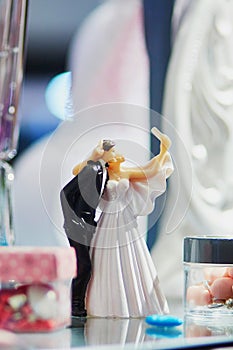 Bride and groom making selfie - wedding cake figurines