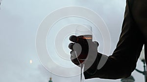 Bride and groom or man and woman clinking glasses with sparkling wine.