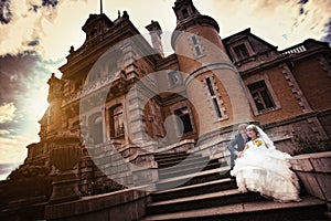 Bride and groom near the ancient castle