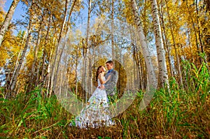 Bride and groom in outdoors during fall