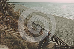 Bride and groom at a photo session in the nature. Baltic sea beach