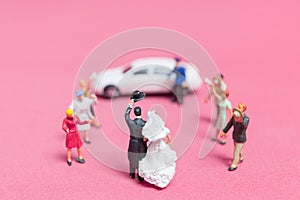 Bride and groom on pink background