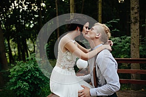 Bride and groom posing on the verandah