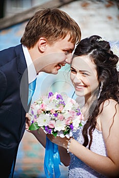 The bride and groom are rolled with laughter