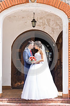 Bride and groom on a romantic moment outdoors