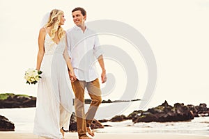 Bride and Groom, Romantic Newly Married Couple Holding Hands Walking on the Beach, Just Married