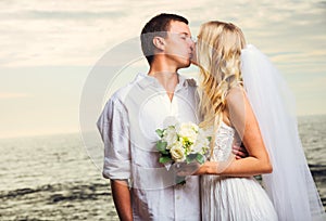 Bride and Groom, Romantic Newly Married Couple Kissing at the Be