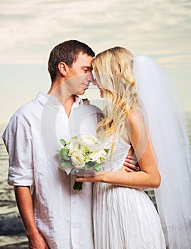 Bride and Groom, Romantic Newly Married Couple Kissing at the Be