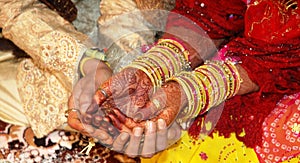 Bride and Groom's hand with Henna tattoo