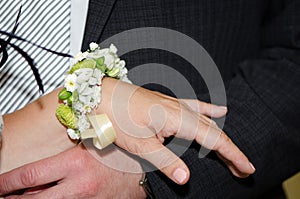 The bride and groom`s hands with rings.