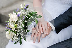 Bride and groom's hands with wedding rings