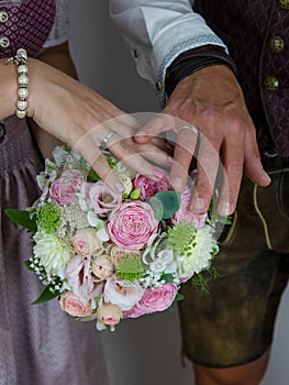 Bride and groom showing their rings