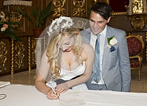 Bride and Groom signing the register