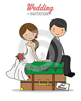 Bride and groom sitting on top of travel suitcases