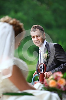 Bride and groom on swing