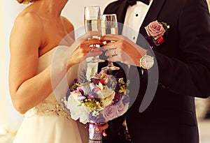 Bride and groom toasting on their wedding day
