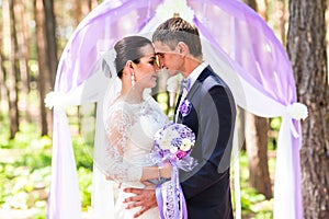 Bride and Groom Under Archway