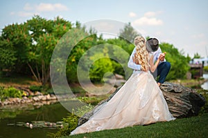 The bride and groom on a walk in the summer. Newlyweds in the park. Summer wedding in nature, Ukraine, Dnipro