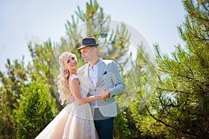 The bride and groom on a walk in the summer. Newlyweds in the park. Summer wedding in nature, Ukraine, Dnipro