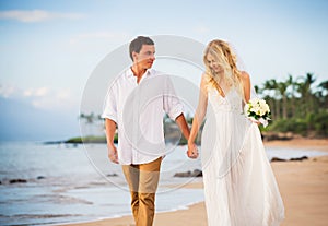 Bride and Groom, Walking on a Beautiful Tropical Beach at Sunset