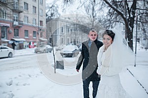 Bride and groom walking on the European city