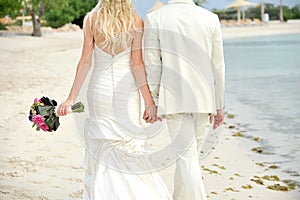 Bride and groom walking hand in hand