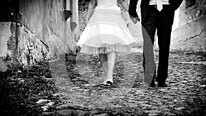 Bride & groom walking holding hands