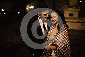 Bride and groom walking through the old town