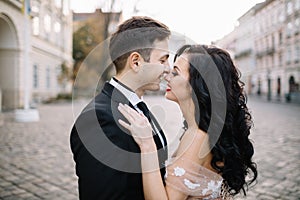 Bride and groom walking through the old town