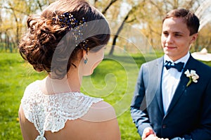 Bride and groom walking at the river