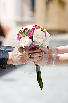 Bride and groom with wedding bouquet