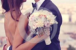 Bride and groom with wedding bouquet