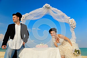 Bride and Groom with wedding cake