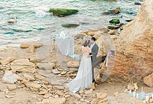 Bride and groom at wedding ceremony near sea