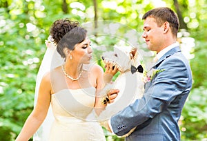 Bride and groom wedding with lovely white dog summer outdoor