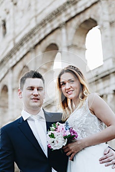 Bride and groom wedding poses in front of Colosseum, Rome, Italy
