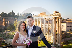 Bride and groom wedding poses in front of Roman Forum, Rome, Italy