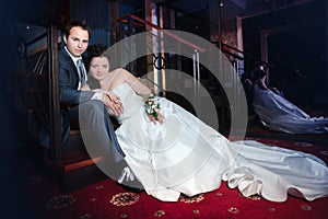 Bride and groom on the wedding walk in the modern hotel hall