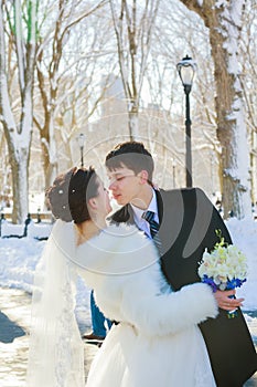 bride and groom in winter park