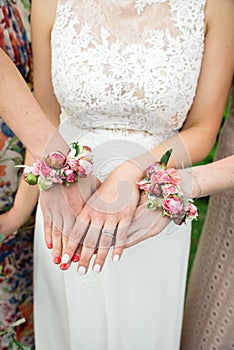 Bride and her bridemaids showing her hands
