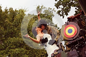 Bride with her groom wearing army suit