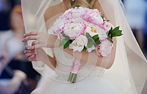 Bride with her peonies bouquet