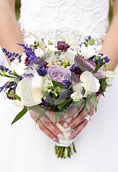 Bride holding a beautiful wedding bouquet