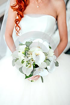 Bride holding bouguet of flowers