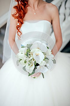 Bride holding bouguet of flowers