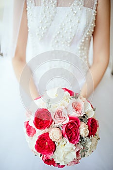 Bride holding bouguet of flowers