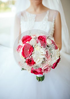 Bride holding bouguet of flowers